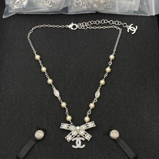 18K  Chanel Bow Tie Diamond Gold Necklace